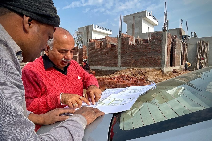Engineers reviewing plans outdoors