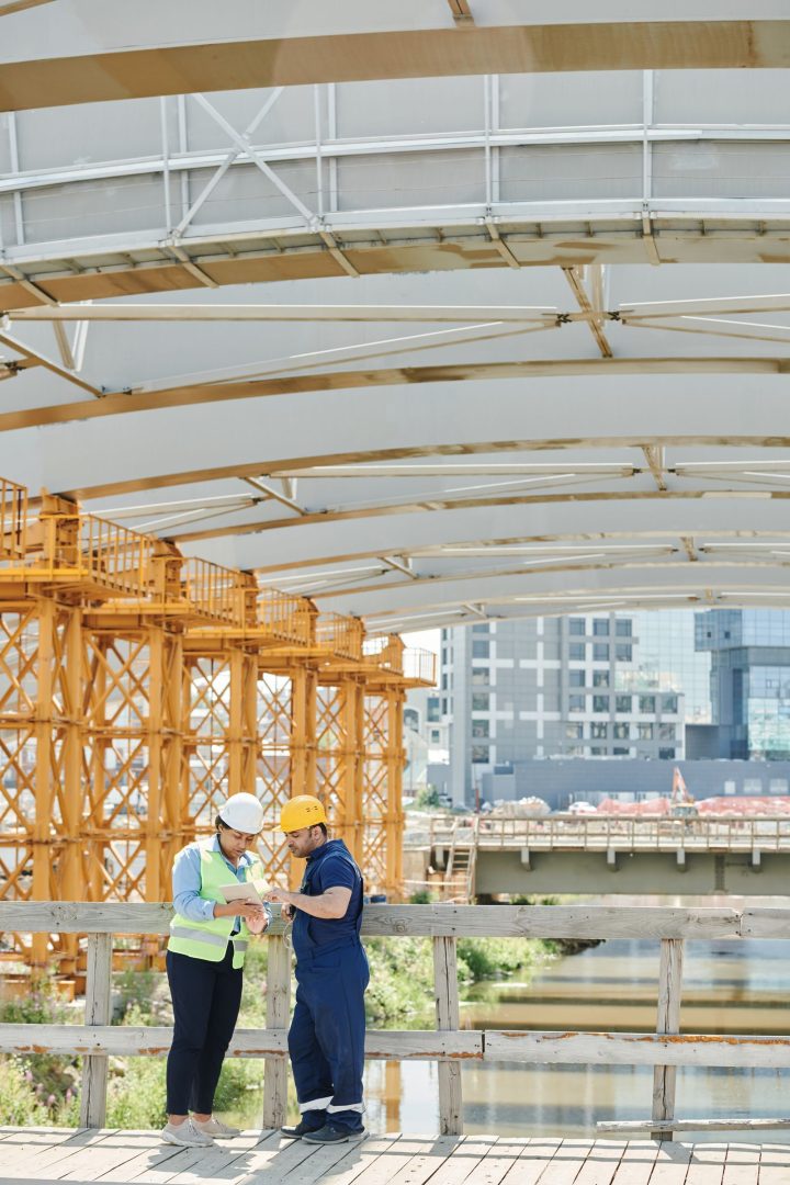 Engineers discussing plans at a construction site